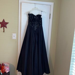 Strapless black sequence long gown.